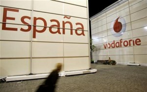 A visitor walks in front of the Vodafone stand during the 3GSM World Congress at the Feria of Barcelona, in central Barcelona February 12, 2007. REUTERS/Gustau Nacarino