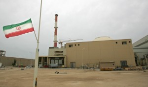 (FILES) An Iranian flag flies outside the building housing the reactor of the Bushehr nuclear power plant, in the Iranian port town of Bushehr, 1200 Kms south of Tehran, 03 April 2007. Russia's Atomstroiexport corporation said 17 December 2007 that it had begun deliveries of nuclear fuel for Iran's first atomic power station at Bushehr. AFP PHOTO/BEHROUZ MEHRI (Photo credit should read BEHROUZ MEHRI/AFP/Getty Images)