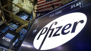 The Pfizer logo appears above a trading post on the floor of the New York Stock Exchange, Monday, Nov. 23, 2015. Pfizer and Allergan are joining in the biggest buyout of the year, a $160 billion stock deal that will create the world's largest drugmaker. (AP Photo/Richard Drew)